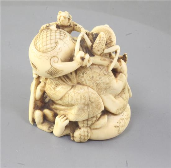 A Japanese ivory okimono netsuke of Shoki and oni, Meiji period, height 5.1cm